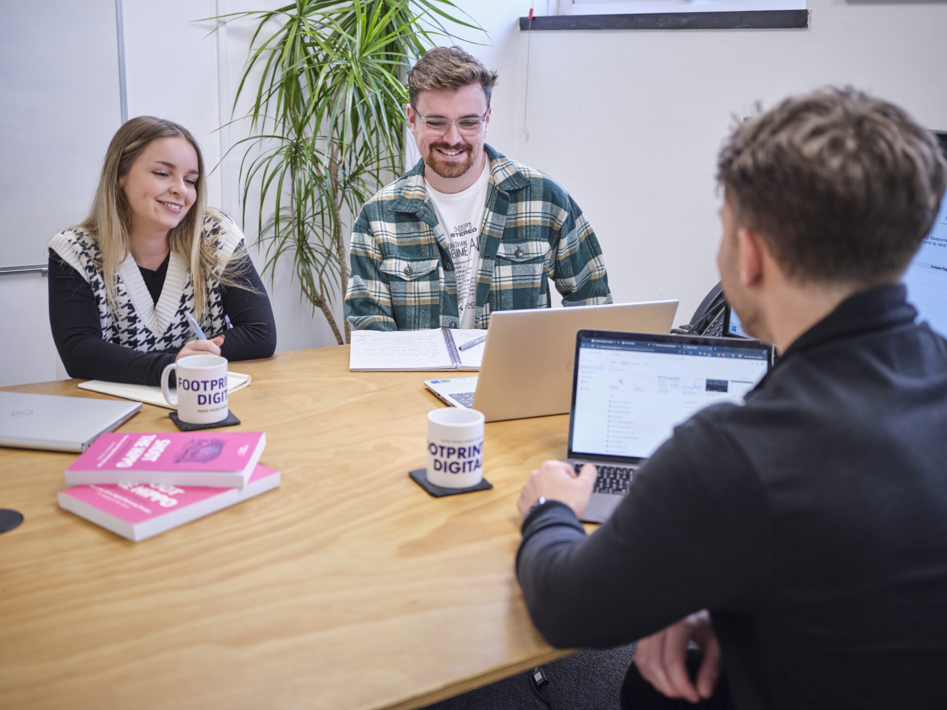 Full colour office shot in meeting room 1 with Kieran, Klaudia, and Joe K