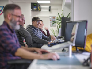 Full colour david, rob, jon, sam in office shot