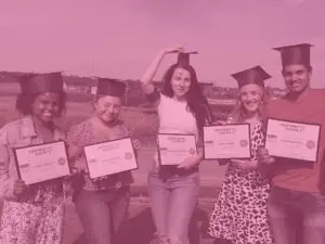 Pink group shot footprint academy graduates in their graduation hats inc rosie, shaak, marketa