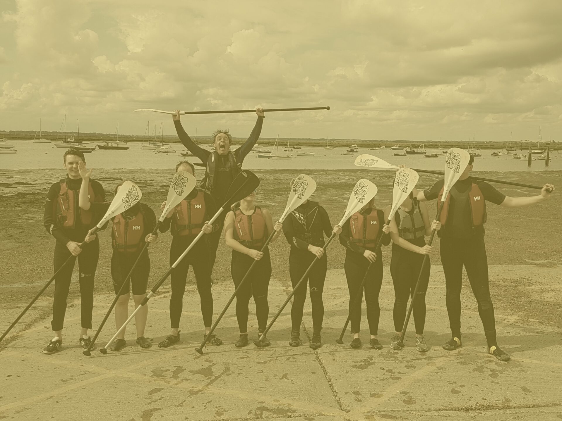 Yellow group shot apprentice challenge paddleboarding in mersea