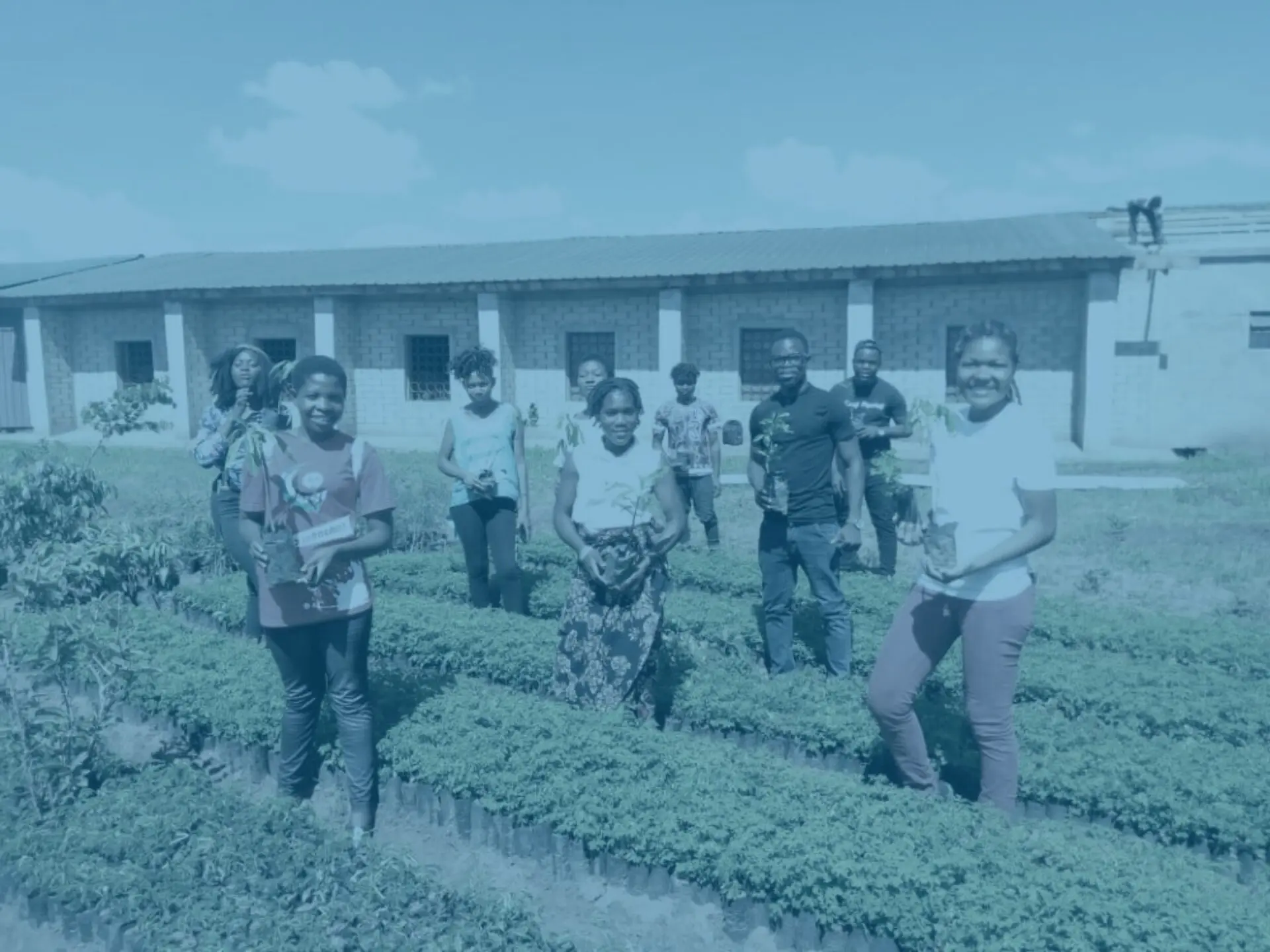 Blue building malawi tree planting group photo