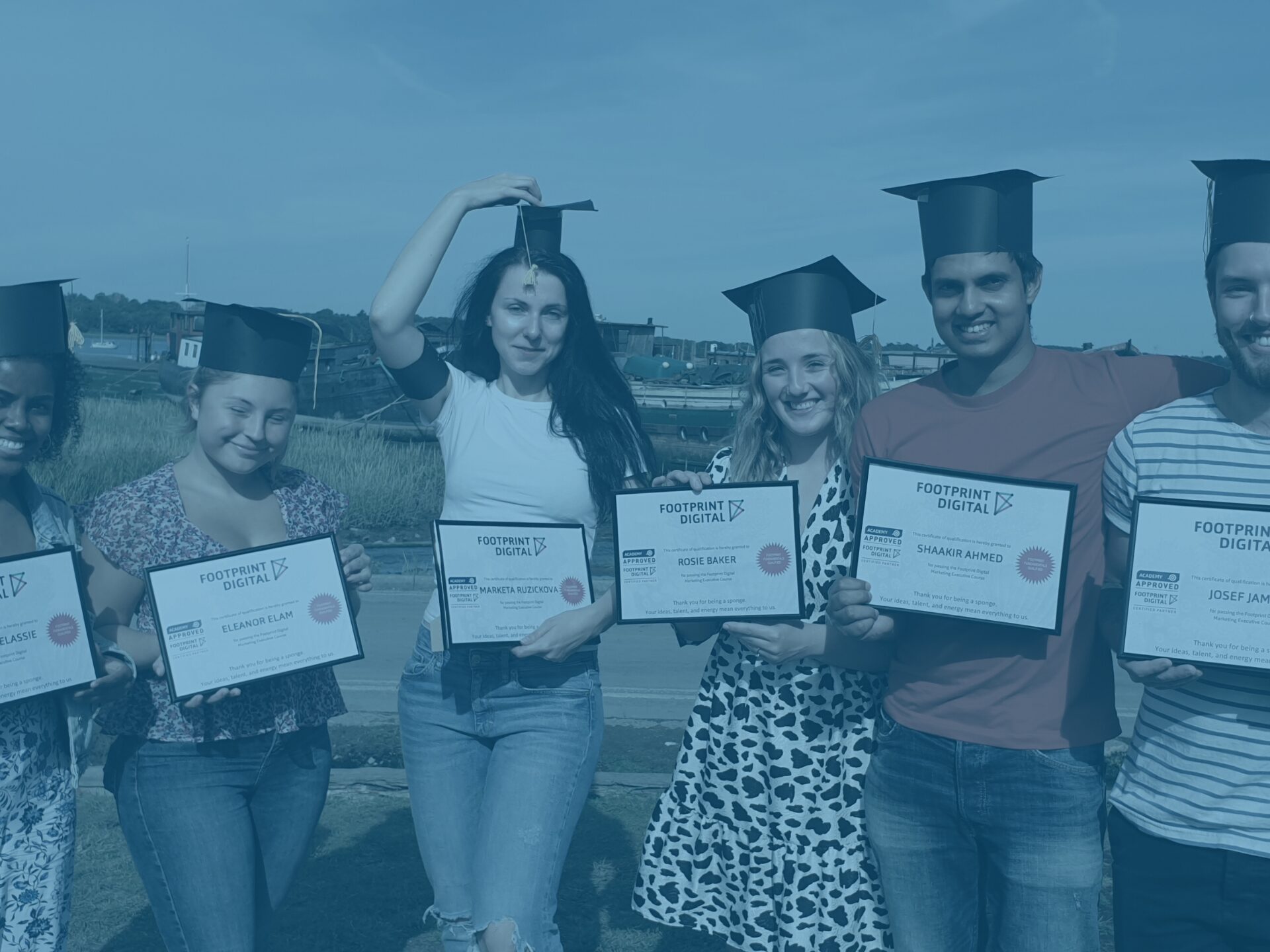 Blue footprint academy graduation day photo with marketa, Josef, shaak, rosie