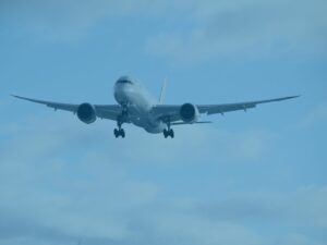 Blue aeroplane in sky