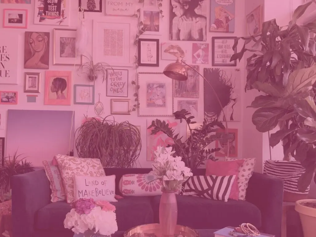 Pink wall covered in art frames