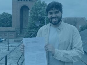 Blue abdul with his published paper at office