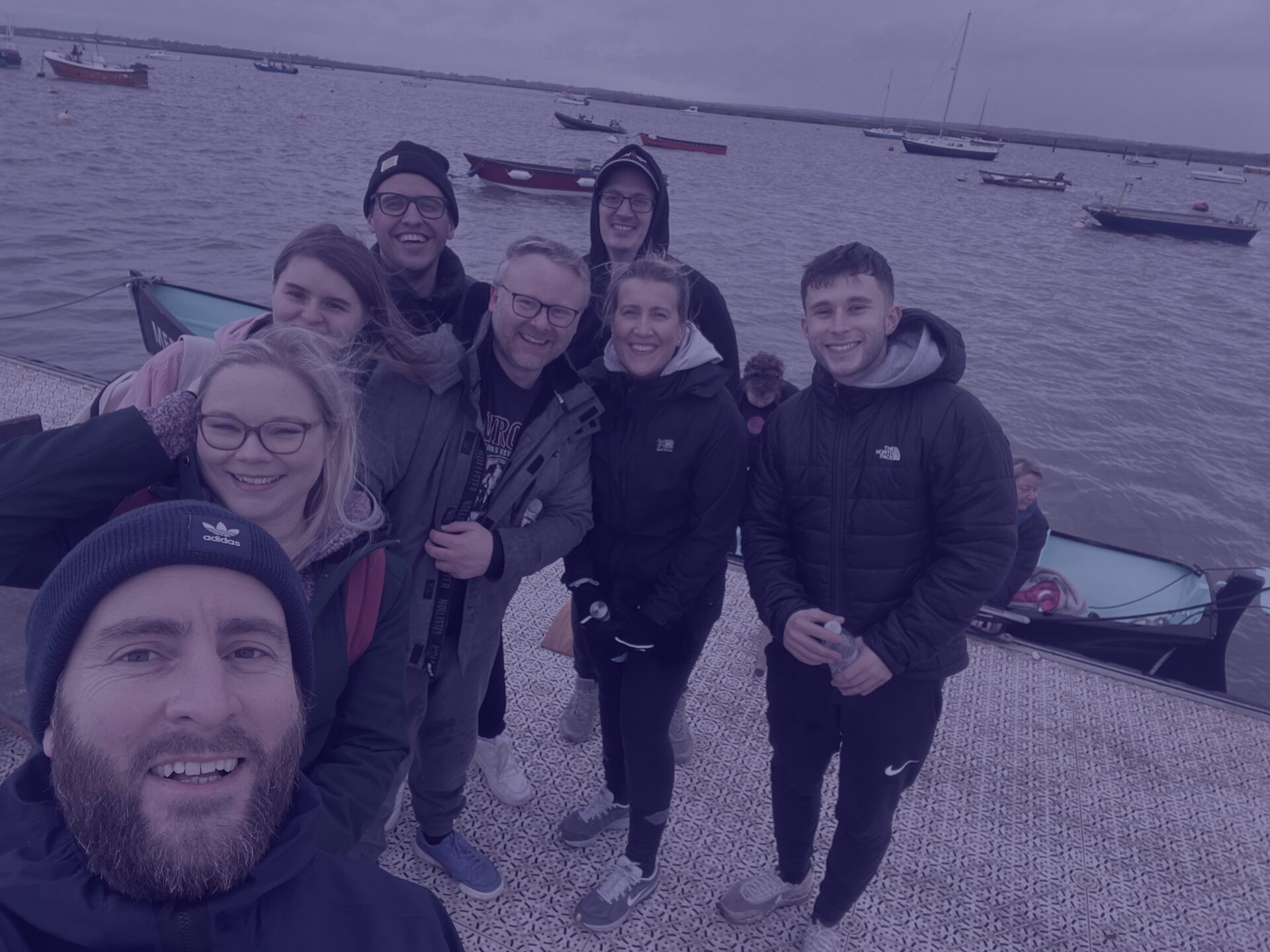 Navy team selfie on mersea island at rowing apprentice challenge tom b, jo, sam, tom c, rob, sarah, joe k