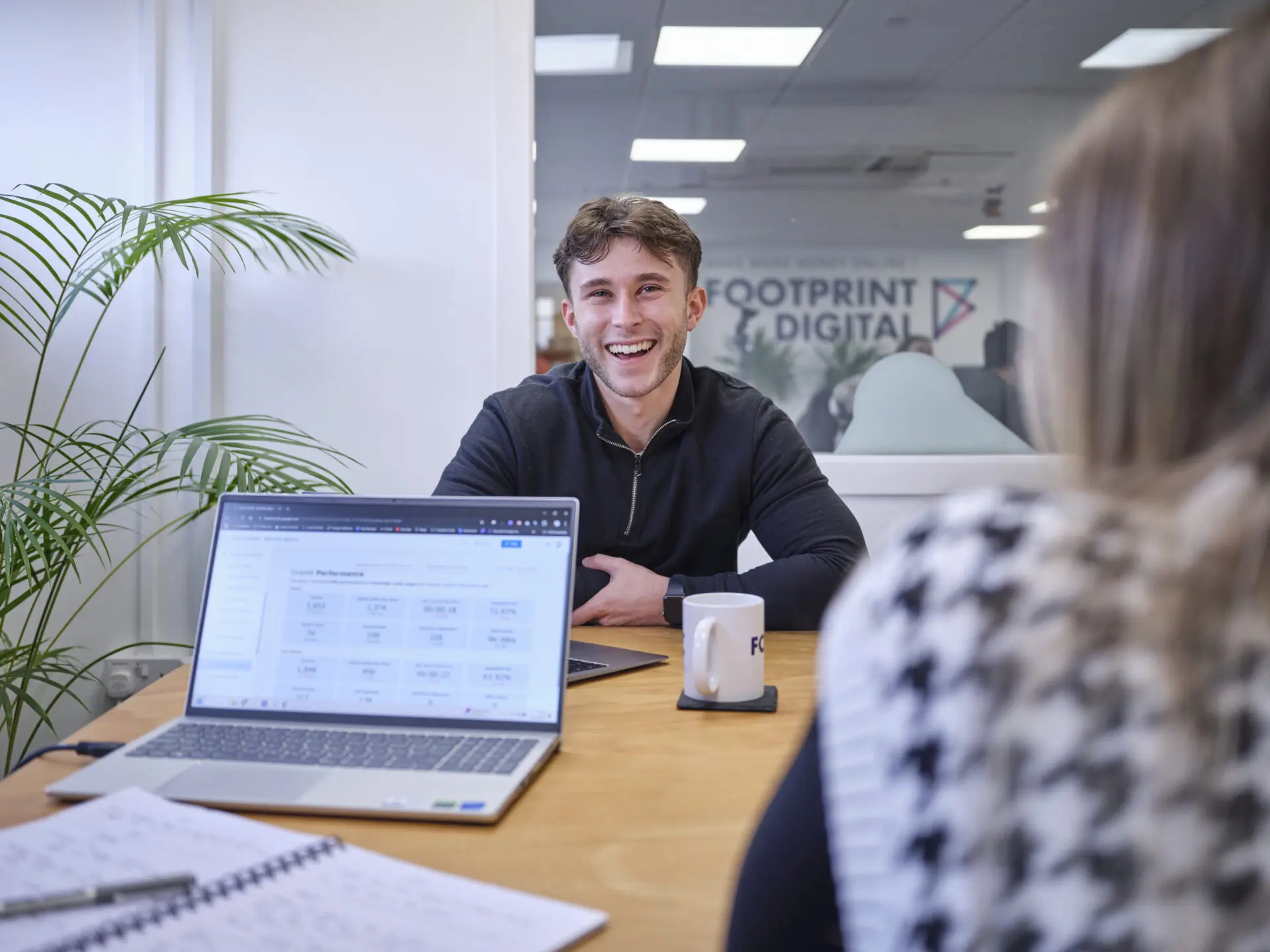 Full colour office shot meeting room 1 Joe K smiling